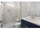 Modern bathroom with a large walk-in shower, a built-in bench seat, and a navy blue vanity at 2735 Marie Way, Cumming, GA 30028