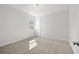 Bright bedroom featuring neutral walls, plush carpeting, and a window with natural light at 2735 Marie Way, Cumming, GA 30028