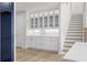 White built-in cabinetry with glass doors and quartz countertops at 2735 Marie Way, Cumming, GA 30028