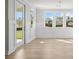 Bright dining room with wainscoting and hardwood floors at 2735 Marie Way, Cumming, GA 30028
