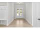 Front entry with view into living room and hardwood floors at 2735 Marie Way, Cumming, GA 30028