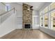 Gathering room with stone fireplace and built-in shelving units at 2735 Marie Way, Cumming, GA 30028
