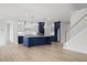 Open concept kitchen with island and navy blue cabinets at 2735 Marie Way, Cumming, GA 30028