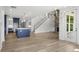 Open concept kitchen with blue island and stainless steel appliances at 2735 Marie Way, Cumming, GA 30028