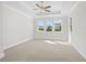 Spacious main bedroom with carpet and large windows at 2735 Marie Way, Cumming, GA 30028