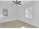 Bright bedroom with two windows and a ceiling fan at 2067 Arlington Nw Cir, Atlanta, GA 30318