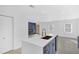 A kitchen features navy cabinets with gold hardware and a kitchen island with white countertops at 2067 Arlington Nw Cir, Atlanta, GA 30318