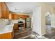 Kitchen with oak cabinets, stainless steel appliances, and vinyl flooring at 2722 S Hills, Riverdale, GA 30296