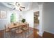 Inviting dining room featuring hardwood floors, modern decor, a ceiling fan, and an open floorplan at 610 Walnut Sw Pl, Marietta, GA 30060