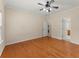 Bright bedroom featuring hardwood floors and ceiling fan at 498 Anglewood Trce, Stockbridge, GA 30281