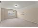 Well-lit bedroom with carpeted floors and window at 498 Anglewood Trce, Stockbridge, GA 30281