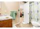 Bathroom featuring vanity with a vintage sink, tile floors, and a shower/toilet combo at 112 Christopher Ln, Stockbridge, GA 30281