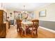 Traditional dining room boasts hardwood floors and natural light at 112 Christopher Ln, Stockbridge, GA 30281