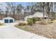 Spacious home with long driveway, detached garage, and well-manicured landscaping at 112 Christopher Ln, Stockbridge, GA 30281