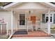 Inviting front porch with rocking chairs and seasonal decor; a welcoming entrance at 112 Christopher Ln, Stockbridge, GA 30281