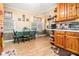 Open kitchen area offers wood cabinets and a bright dining space at 112 Christopher Ln, Stockbridge, GA 30281