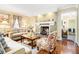 Cozy living room featuring a fireplace, hardwood floors, and comfortable seating at 112 Christopher Ln, Stockbridge, GA 30281