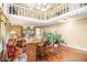 Cozy living room featuring hardwood floors, staircase and eye-catching chandelier at 112 Christopher Ln, Stockbridge, GA 30281