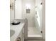 Modern bathroom with glass-enclosed shower, white subway tile, and elegant fixtures at 1188 Lupo Loop, Chattahoochee Hills, GA 30268