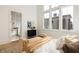 Bright bedroom features a plush bed, natural light and ensuite bathroom at 1188 Lupo Loop, Chattahoochee Hills, GA 30268