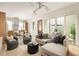 Bright living room featuring stylish seating, modern lighting, and sliding doors to the patio at 1188 Lupo Loop, Chattahoochee Hills, GA 30268