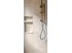 Detailed view of shower featuring bronze hardware and built in shelving at 1188 Lupo Loop, Chattahoochee Hills, GA 30268