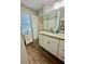 Modern bathroom with granite countertop and white cabinets at 3385 Continental Dr, Cumming, GA 30041