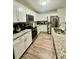 Modern kitchen with granite countertops and stainless steel appliances at 3385 Continental Dr, Cumming, GA 30041