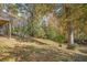 Grassy backyard surrounded by mature trees and foliage at 490 E Pharr Rd, Decatur, GA 30030