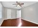 Spacious bedroom with hardwood floors and ceiling fan at 1852 Red Rose Ln, Loganville, GA 30052