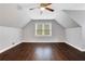 Large bedroom with hardwood floors, vaulted ceiling and ceiling fan at 1852 Red Rose Ln, Loganville, GA 30052