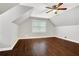 Spacious bedroom with dark hardwood floors and ceiling fan at 1852 Red Rose Ln, Loganville, GA 30052