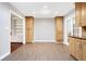 Bright dining area with wood-look floors and built-in cabinetry at 1852 Red Rose Ln, Loganville, GA 30052