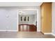 View from kitchen to living room with hardwood floors and bay window at 1852 Red Rose Ln, Loganville, GA 30052