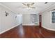 Spacious living room with hardwood floors, neutral walls, and a ceiling fan at 1852 Red Rose Ln, Loganville, GA 30052