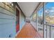 Inviting front porch with wooden flooring at 1852 Red Rose Ln, Loganville, GA 30052