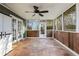 Sunroom with terracotta tile floor and ceiling fan at 1852 Red Rose Ln, Loganville, GA 30052