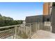 Private balcony overlooking a treetop and partial pool view at 775 Juniper Ne St # 614, Atlanta, GA 30308