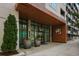 Modern building entrance with large glass doors at 775 Juniper Ne St # 614, Atlanta, GA 30308