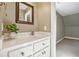 Chic bathroom with a white vanity, marble countertop, and framed mirror at 220 Spring Branch Dr, Canton, GA 30115