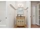 Charming bathroom features vintage-style vanity with floral accents and a decorative mirror at 220 Spring Branch Dr, Canton, GA 30115