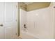 Bright bathroom showcasing a clean white bathtub and shower, enhanced by a white tiled wall at 220 Spring Branch Dr, Canton, GA 30115