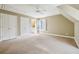 Neutral bedroom featuring plush carpeting, ample closet space, and a connecting bathroom for added convenience at 220 Spring Branch Dr, Canton, GA 30115