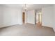 Spacious bedroom with neutral carpeting and multiple doorways offers versatility and easy access to other areas at 220 Spring Branch Dr, Canton, GA 30115