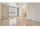 Inviting bedroom featuring built-in bookshelves and a large window with plantation shutters at 220 Spring Branch Dr, Canton, GA 30115