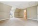 Cozy carpeted bedroom with dormer window and a ceiling fan that offers a comfortable and inviting retreat at 220 Spring Branch Dr, Canton, GA 30115