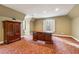 Versatile room with a desk and a large built-in cabinet, illuminated by natural light from the window at 220 Spring Branch Dr, Canton, GA 30115