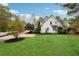 Charming home with a well-manicured front lawn and mature landscaping at 220 Spring Branch Dr, Canton, GA 30115