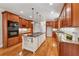 Gourmet kitchen featuring custom cabinetry, a center island, granite countertops, and modern appliances at 220 Spring Branch Dr, Canton, GA 30115
