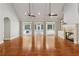 Spacious living area features a fireplace, built-in shelving, and French doors to the screened in porch at 220 Spring Branch Dr, Canton, GA 30115